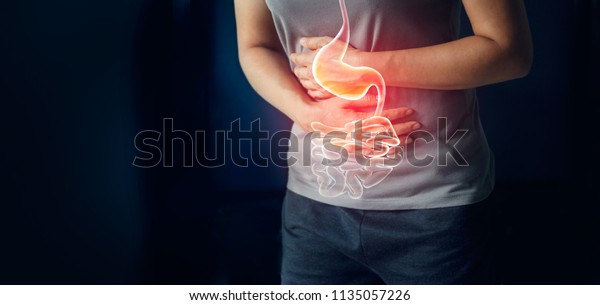 Woman touching stomach painful suffering from
stomachache causes of menstruation period, gastric ulcer,
appendicitis or gastrointestinal system desease. Healthcare and
health insurance concept