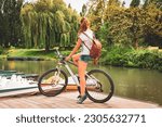 Woman tourist in bicycle in Marais Poitevin- Marshland in France