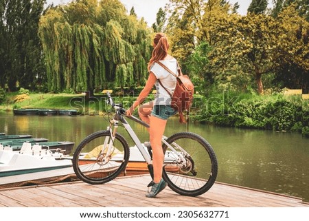 Woman tourist in bicycle in Marais Poitevin- Marshland in France