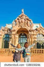 Woman Tourist Couple Friends With Lgbt Rainbow Flag At Zwinger Palace In Dresden, Travel And Love In Europe Concept