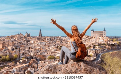 Woman tourist enjoying panoramic view of Toledo city- Castilla la Mancha, Spain - Shutterstock ID 2310089457