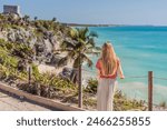 Woman tourist enjoying the view Pre-Columbian Mayan walled city of Tulum, Quintana Roo, Mexico, North America, Tulum, Mexico. El Castillo - castle the Mayan city of Tulum main temple