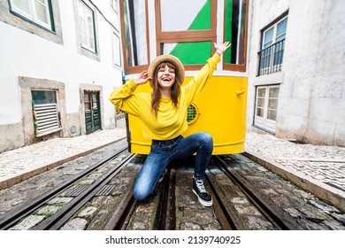 Woman Tourist With Famous Yellow Funicular Tram Of Lisbon, Portugal - Tourist Attraction - Europe Destinations Lifestyle Concept