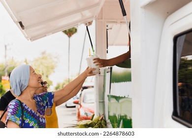 Woman tourist having drink at street food festival outdoor - Powered by Shutterstock