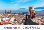 Woman tourist at Jaen, looking at panoramic view of the cathedral- Spain