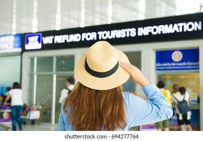 Woman Tourist Is Looking At Currency Exchange Booth At The Airport.