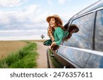 Woman tourist on road, enjoying window view and traveling on holiday road trip. Travel adventure drive.