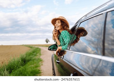 Woman tourist on road, enjoying window view and traveling on holiday road trip. Travel adventure drive. - Powered by Shutterstock