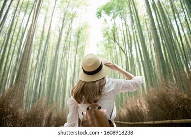 A Woman Tourist Is Sightseeing And Traveling At Arashiyama Bamboo Forest In Kyoto, Japan.