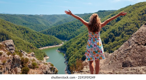 Woman Tourist Standing On Rock,  Enjoying Dordogne River And Forest View