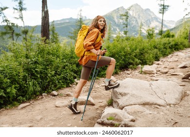 Woman tourist traveler walking along hiking trails in the mountains among forests and cliffs. Travel Slovakia, Europe. Concept of trekking, active lifestyle. Adventures. - Powered by Shutterstock