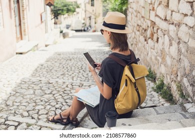 Woman Tourist Using Smartphone During Travel. Travel Alone, Active Lifestyle, Enjoy Life, Summer Holidays, Vacations, People, Technology, Connection, Communication Concept