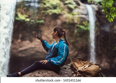 Woman Tourists Is Shooting A Waterfall She Is Video Call With Her Boyfriend.