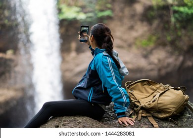 Woman Tourists Is Shooting A Waterfall She Is Video Call With Her Boyfriend.