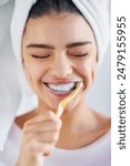 Woman, towel and happy with brushing teeth in home for oral hygiene, cleaning or plaque removal. Toothbrush, smile and person with satisfaction for fresh breath, health or morning routine in bathroom