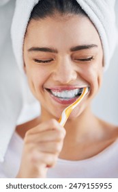 Woman, towel and happy with brushing teeth in home for oral hygiene, cleaning or plaque removal. Toothbrush, smile and person with satisfaction for fresh breath, health or morning routine in bathroom