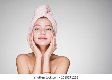 woman with towel on her head after cream
