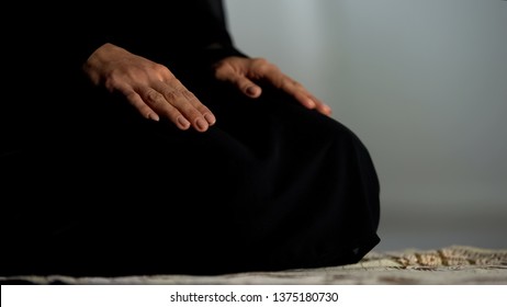 Woman In Traditional Black Hijab Kneeling On Prayer Mat Mosque, Islamic Culture