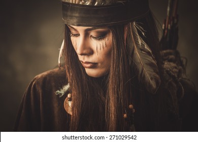 Woman with traditional indian headdress and face paint 