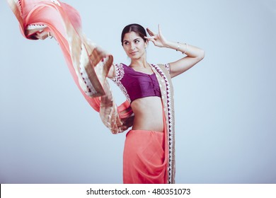 woman in traditional indian sari dancing
