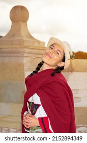 Woman In Traditional Peasant Dress Posing In Front Of Colonial Architecture