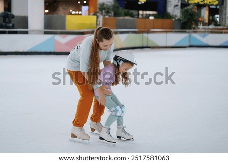 Similar – Image, Stock Photo Young woman trainer teaching the different exercises to a student while they exercise with a smile.