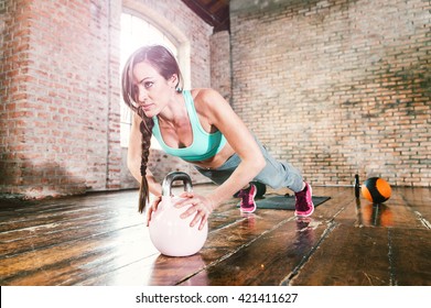 Woman Training Hard With Push Up Exercise In Her Gym