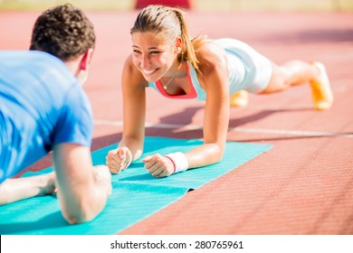 Woman Training With Personal Trainer