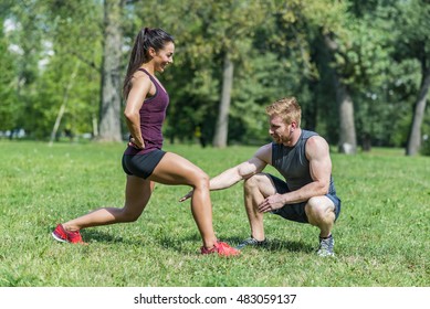 Woman Training With Personal Trainer Outdoor