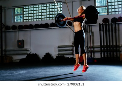 Woman Training Snatch At Gym