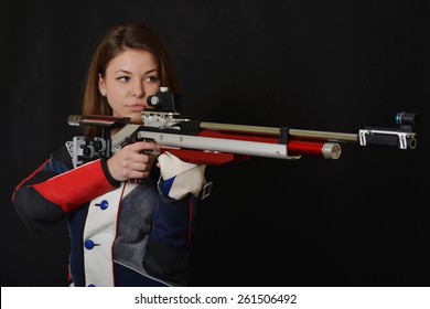 Woman Training Sport Shooting With Air Rifle Gun