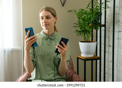 Woman Transfer Data From Old To New Phone With Cable Connection