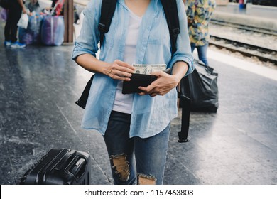 Woman Travel With Backpack US Dollars Money In Wallet, Financial Plan For Tourism.