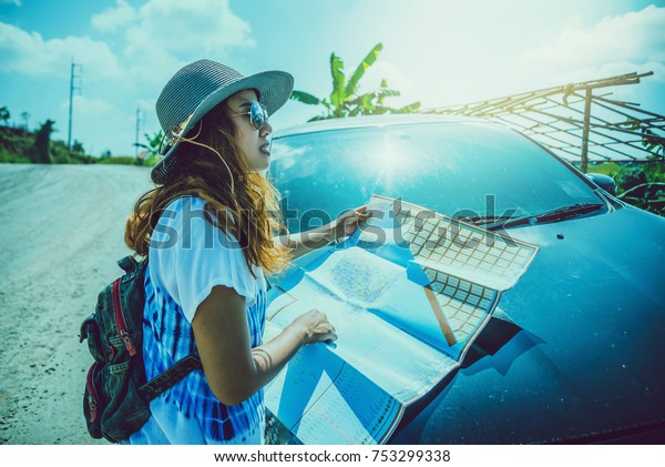 woman  travel. Female travelers travel\
nature mountain map navigation. Travel by\
car