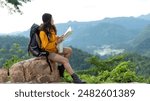 Woman travel hiker adventure on mountain nature landscape.  Asia people lifestyle tourist girl backpack sitting with map to find directions explore and camping outdoors for relax summer time
