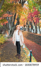 Woman Travel In Japan., Autumn Season Portrait Of Young Asian Beautiful Woman In Park Of Japan.  Beauty Fashion Concept At Japan.