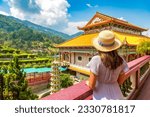 Woman traveler at  Kek Lok Si Temple in Georgetown, Penang island, Malaysia