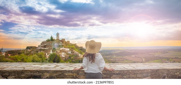 woman traveler looking at city landscape view panorama- Portugal - Shutterstock ID 2136997851
