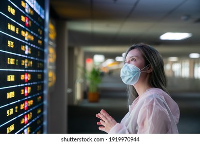 Woman Traveler With Mask Looking Fright Status At Airport. Travel New Normal, COVID-19 Virus Concept.