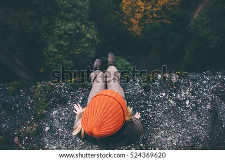 Woman Traveler sitting on cliff bridge with forest aerial view Travel Lifestyle adventure vacations concept 
