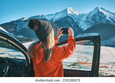 Woman traveling exploring, enjoying the view of the mountains, landscape, lifestyle concept winter vacation outdoors.
Female standing near the car in sunny day - Shutterstock ID 2191200575