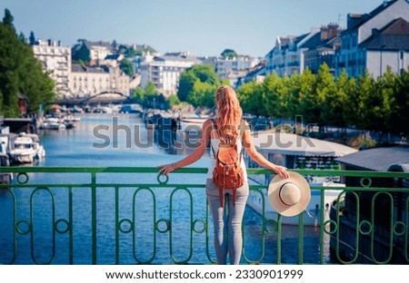 Woman traveling in France- the Erdre river in Nantes