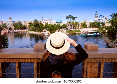 Woman is traveling into old town vintage. - Shutterstock ID 1073000291