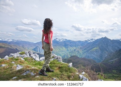 Woman Trekking At Picos De Europa Mountains In Asturias