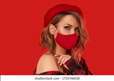 Woman In Trendy Fashion Outfit During Quarantine Of Coronavirus Outbreak. Model Dressed Protective Stylish Handmade Face Mask And Red Beret. Monochrome Look