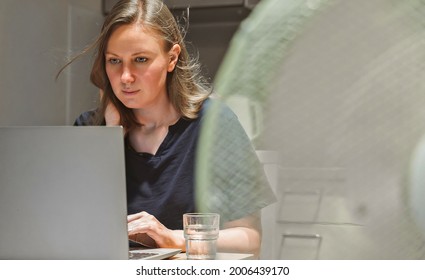 Woman Tries To Work During The Extreme Heat.