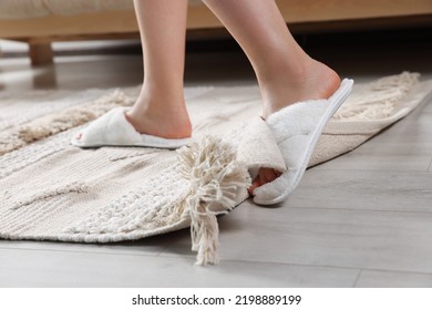 Woman Tripping Over Rug At Home, Closeup