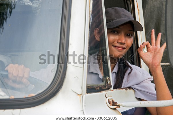 woman truck driver in the\
car