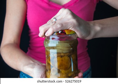 Woman Trying To Open A Jar