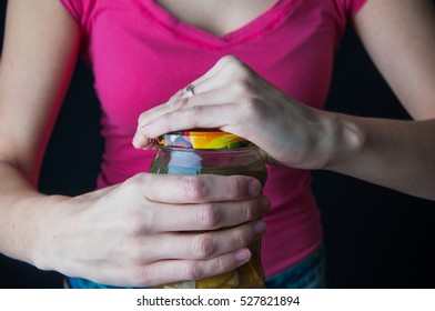 Woman Trying To Open A Jar